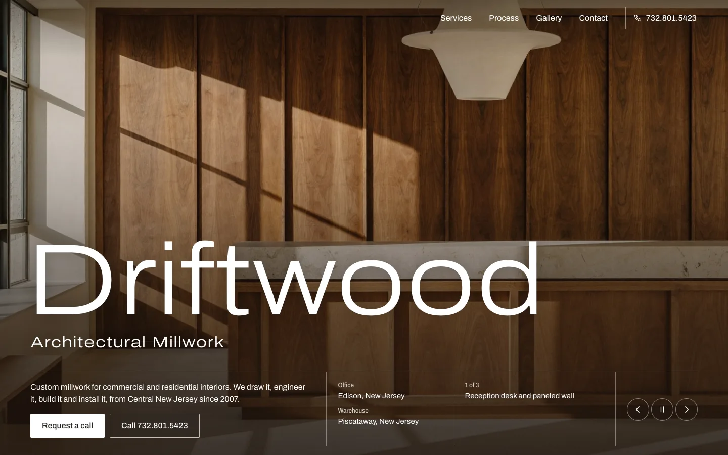 Driftwood Architectural Millwork homepage: dark wood paneling with a large white wordmark at lower left.